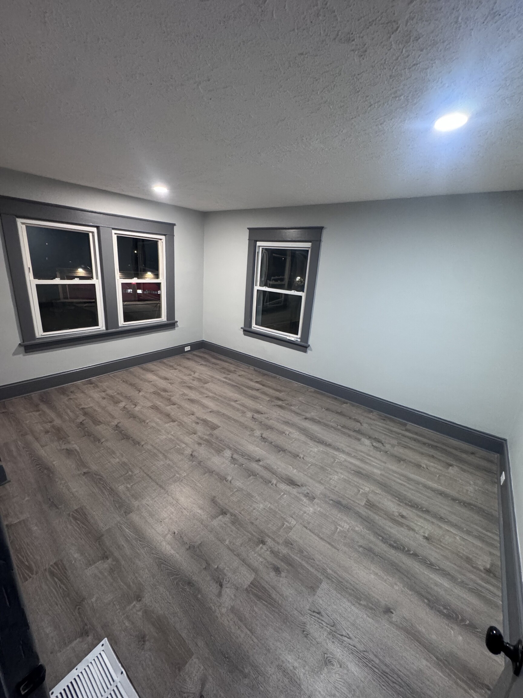 95 New Canaan Avenue, Unit 2 Norwalk, CT 06850 - Photo 7 of 8 a view of an empty room with window and wooden floor