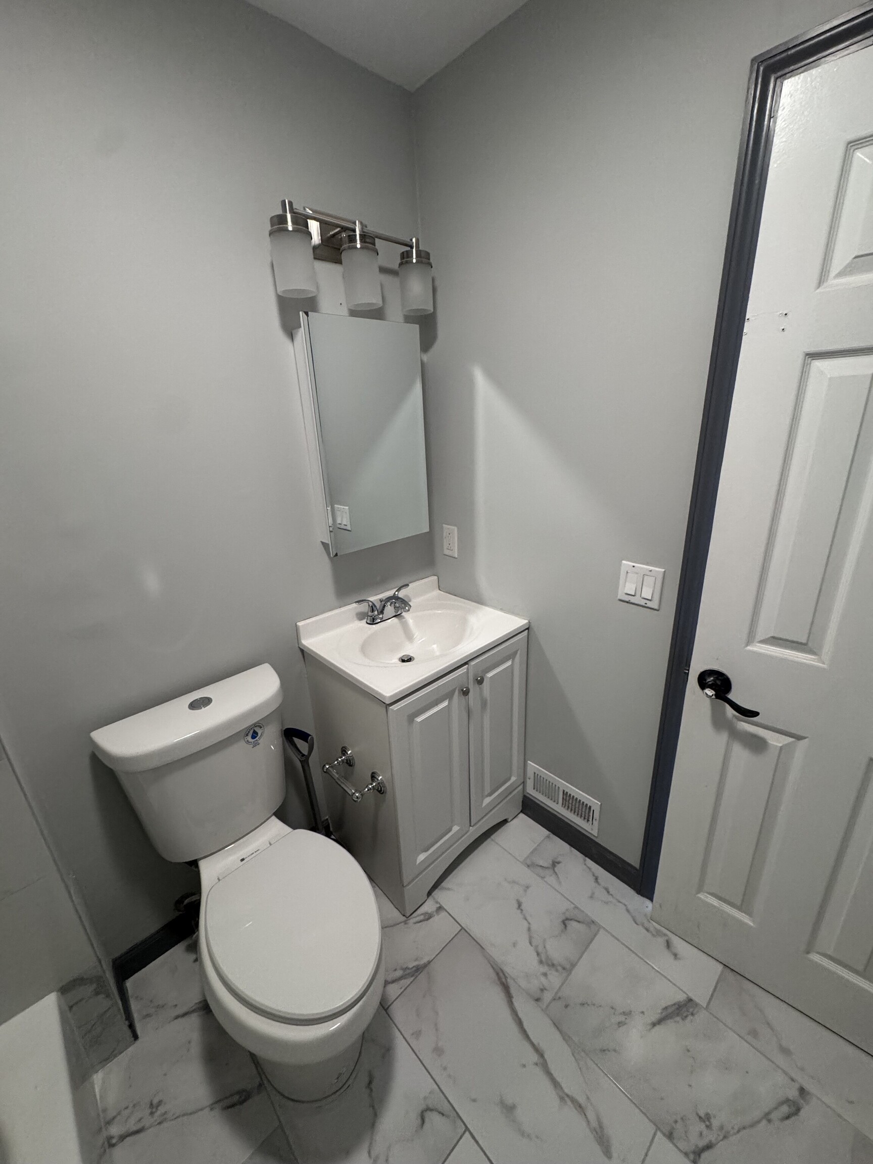 95 New Canaan Avenue, Unit 2 Norwalk, CT 06850 - Photo 8 of 8 a bathroom with a sink and a toilet