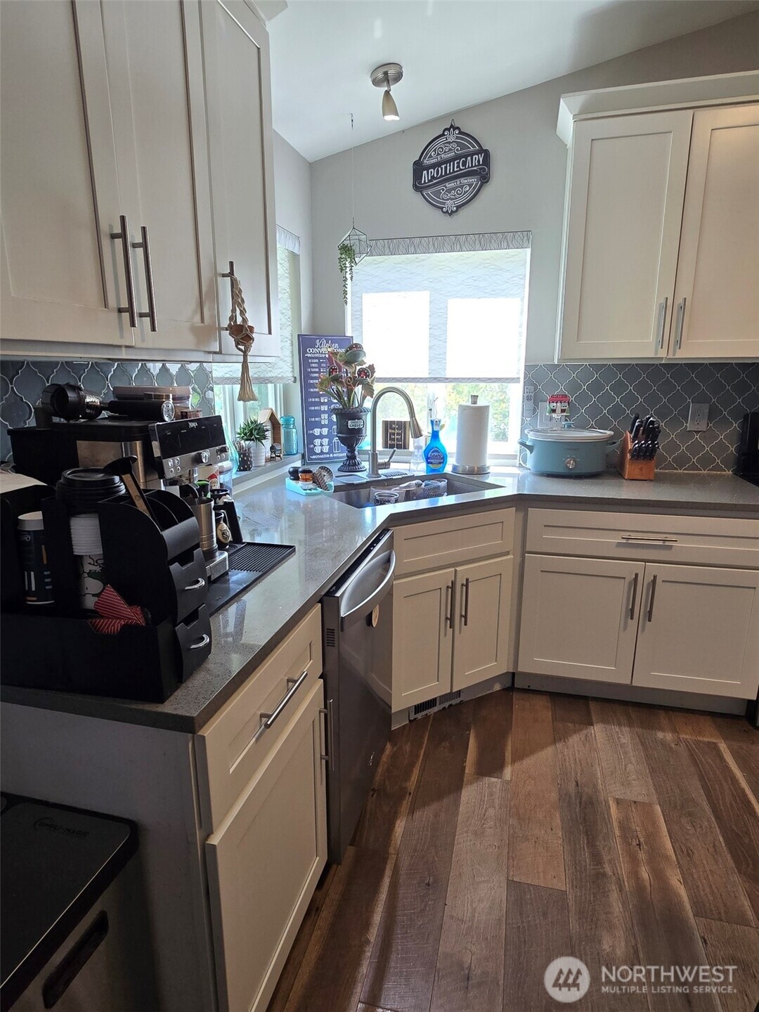 6611 Crescent Beach Road Northwest Vaughn, WA 98394 - Photo 9 of 17 a kitchen with a sink cabinets and window