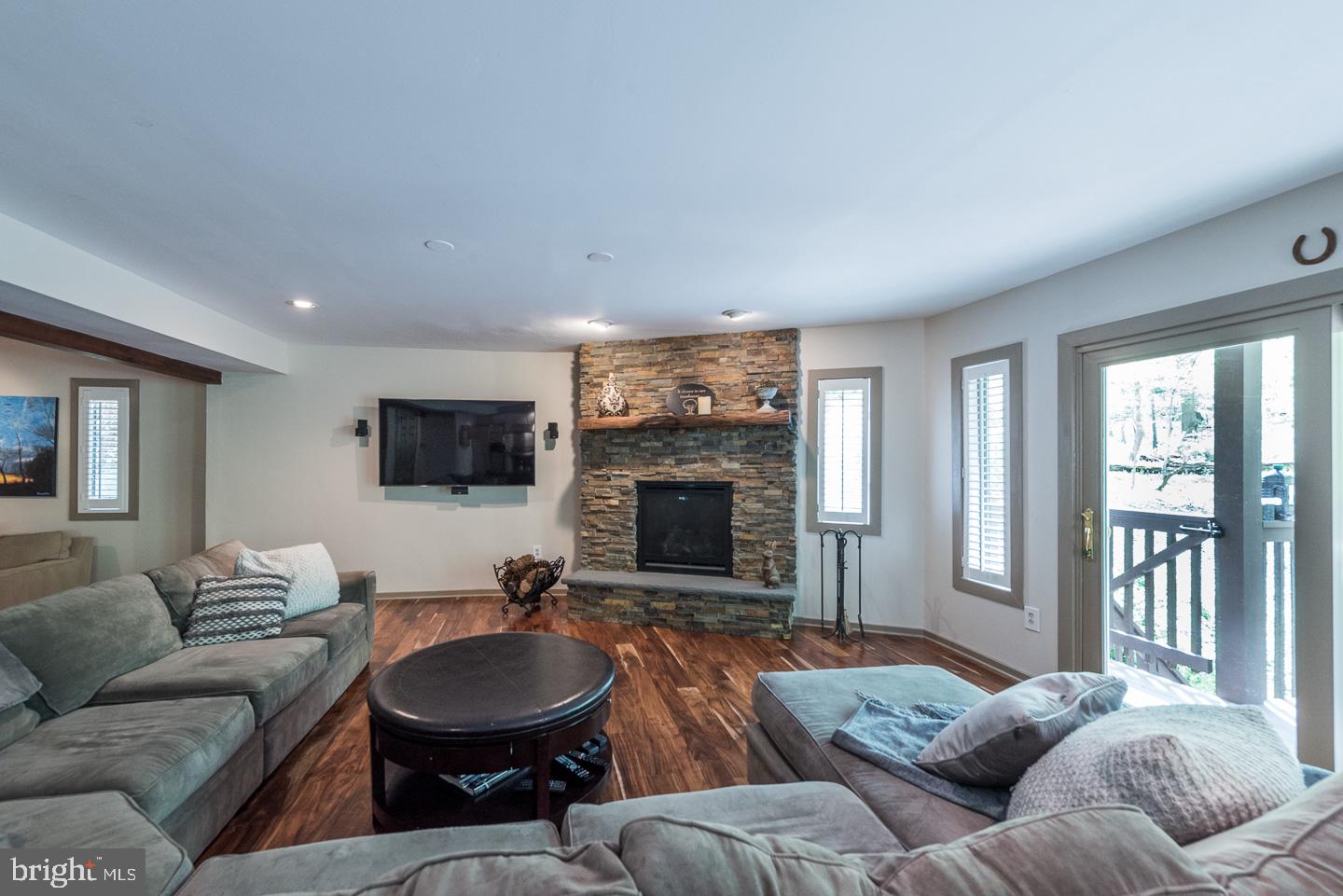 23 Ringfield Road Chadds Ford, PA 19317 - Photo 6 of 29 Floor-to-Ceiling Ledgestone-Surround Gas Fireplace