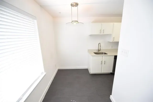 a room with a sink and a cabinet