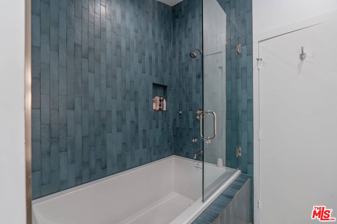 249 Paradise Cove Road Malibu, CA 90265 - Photo 24 of 41 a bathroom with a bathtub and shower