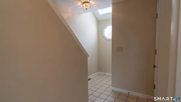 a view of a livingroom with stairs