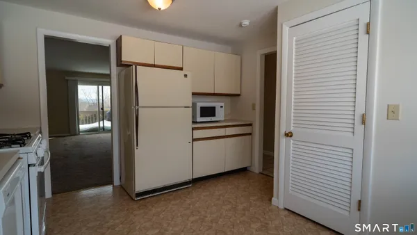 a view of kitchen and utility room