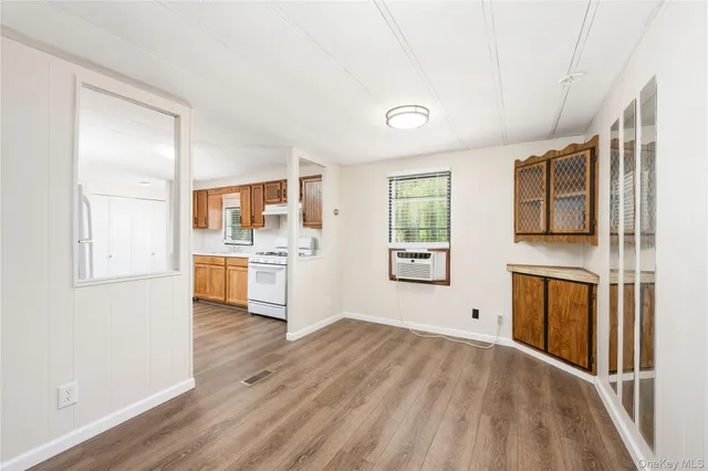 a view of a kitchen with a sink dishwasher and a refrigerator