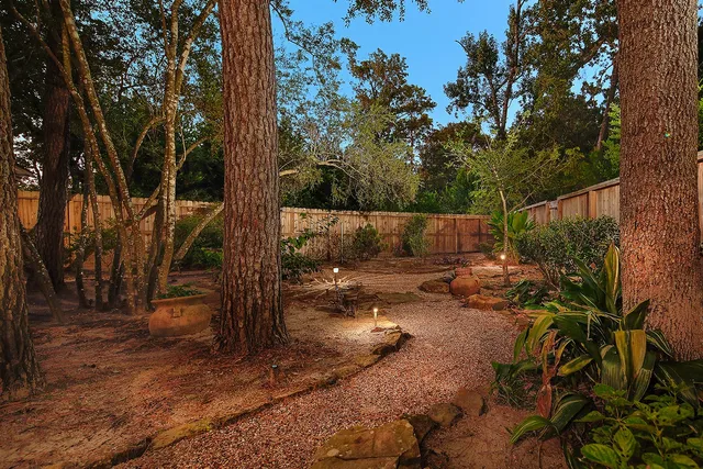 a backyard of a house with lots of green space