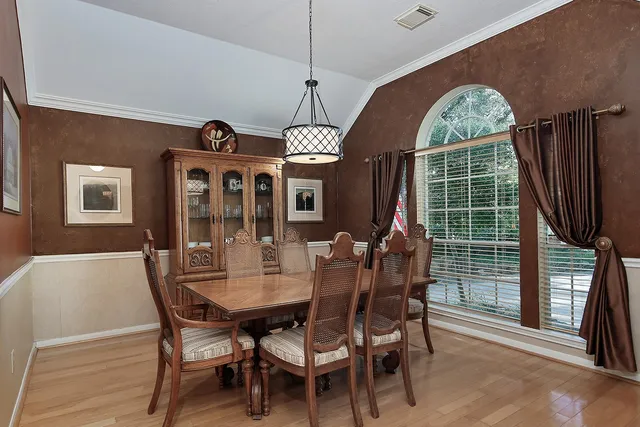 a dining room with furniture window and outside view