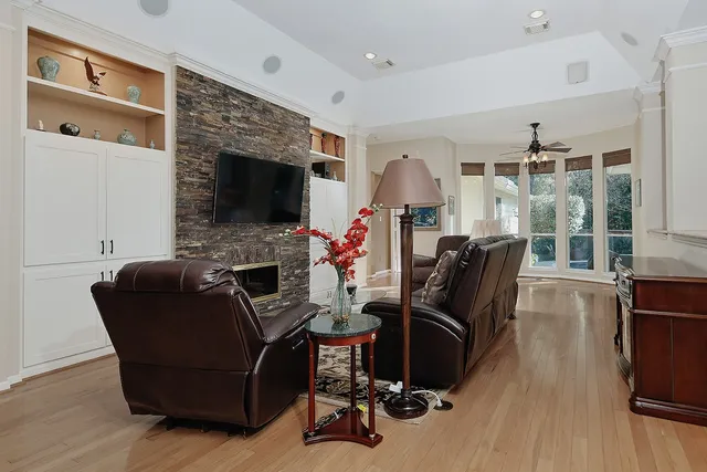 a living room with furniture and a fireplace