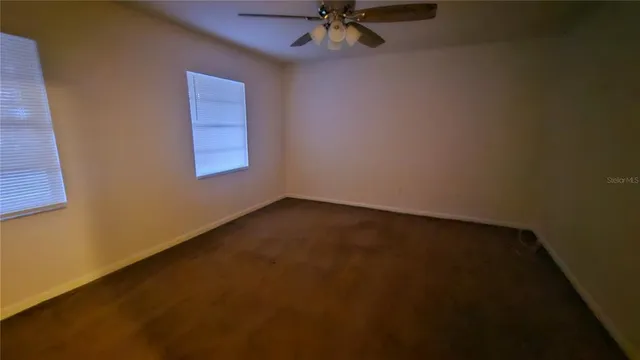 an empty room with a empty space and window