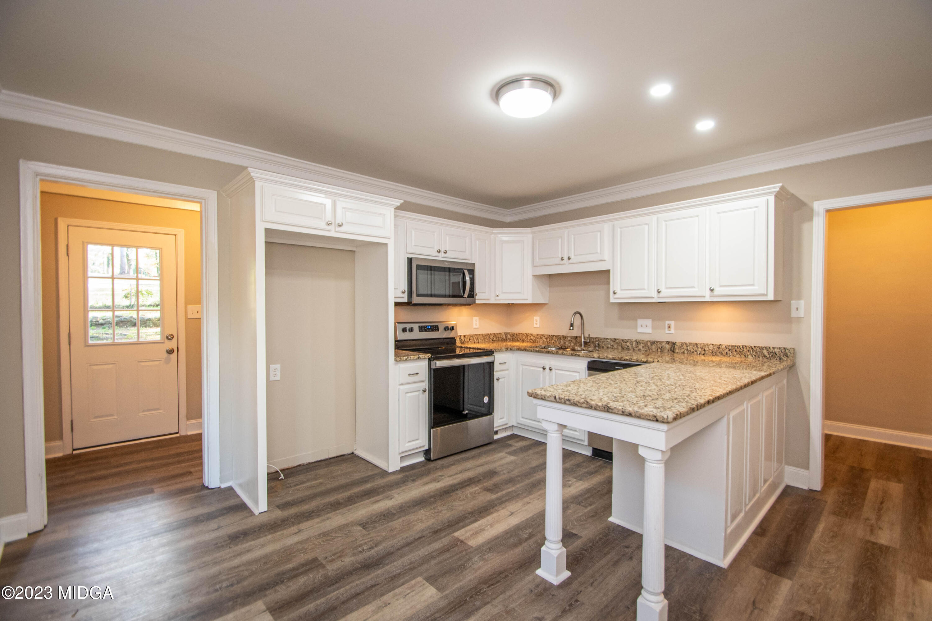 225 R Street Northwest Thomaston, GA 30286 - Photo 13 of 22 a kitchen with a sink stove and refrigerator