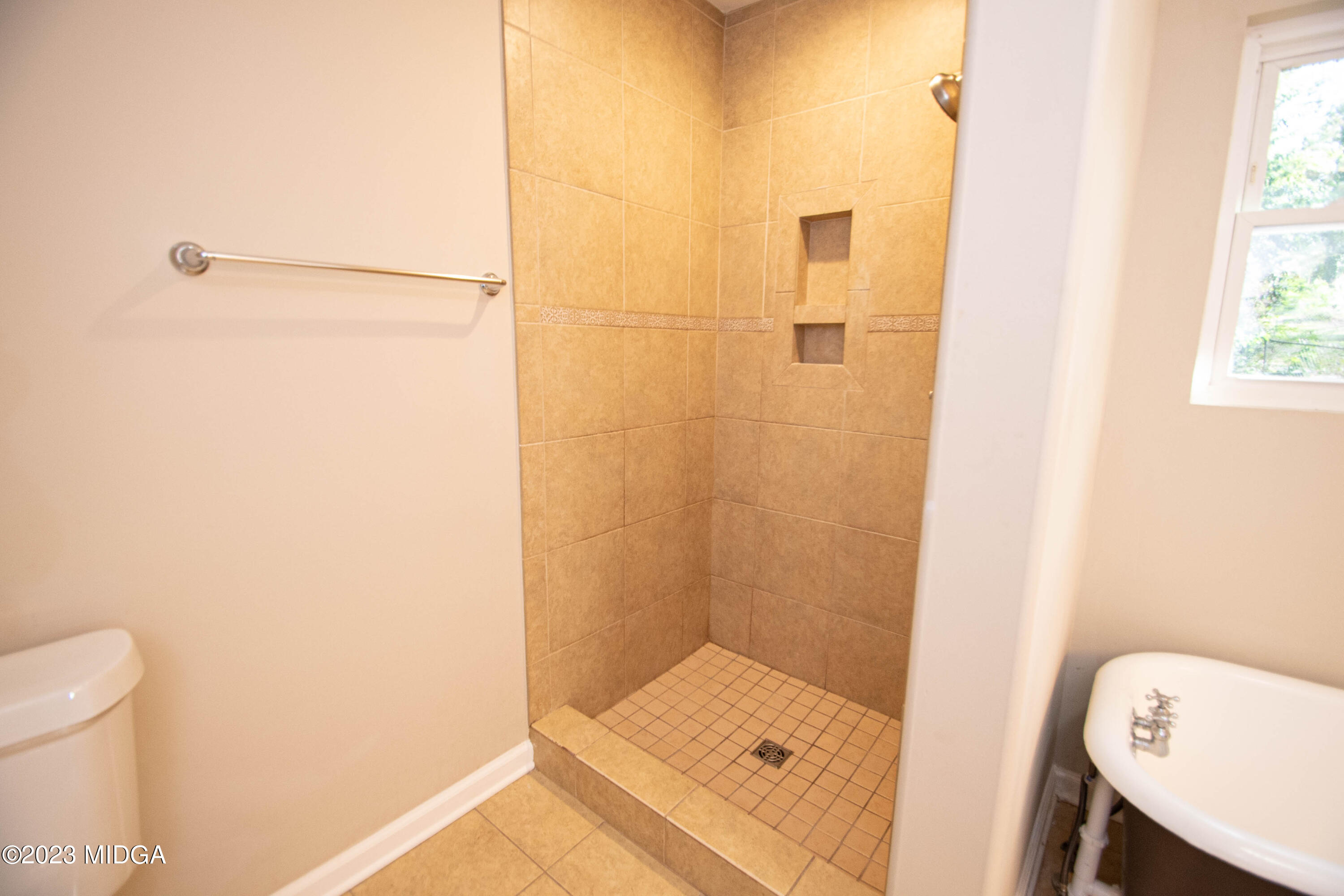 225 R Street Northwest Thomaston, GA 30286 - Photo 20 of 22 a bathroom with a shower and toilet