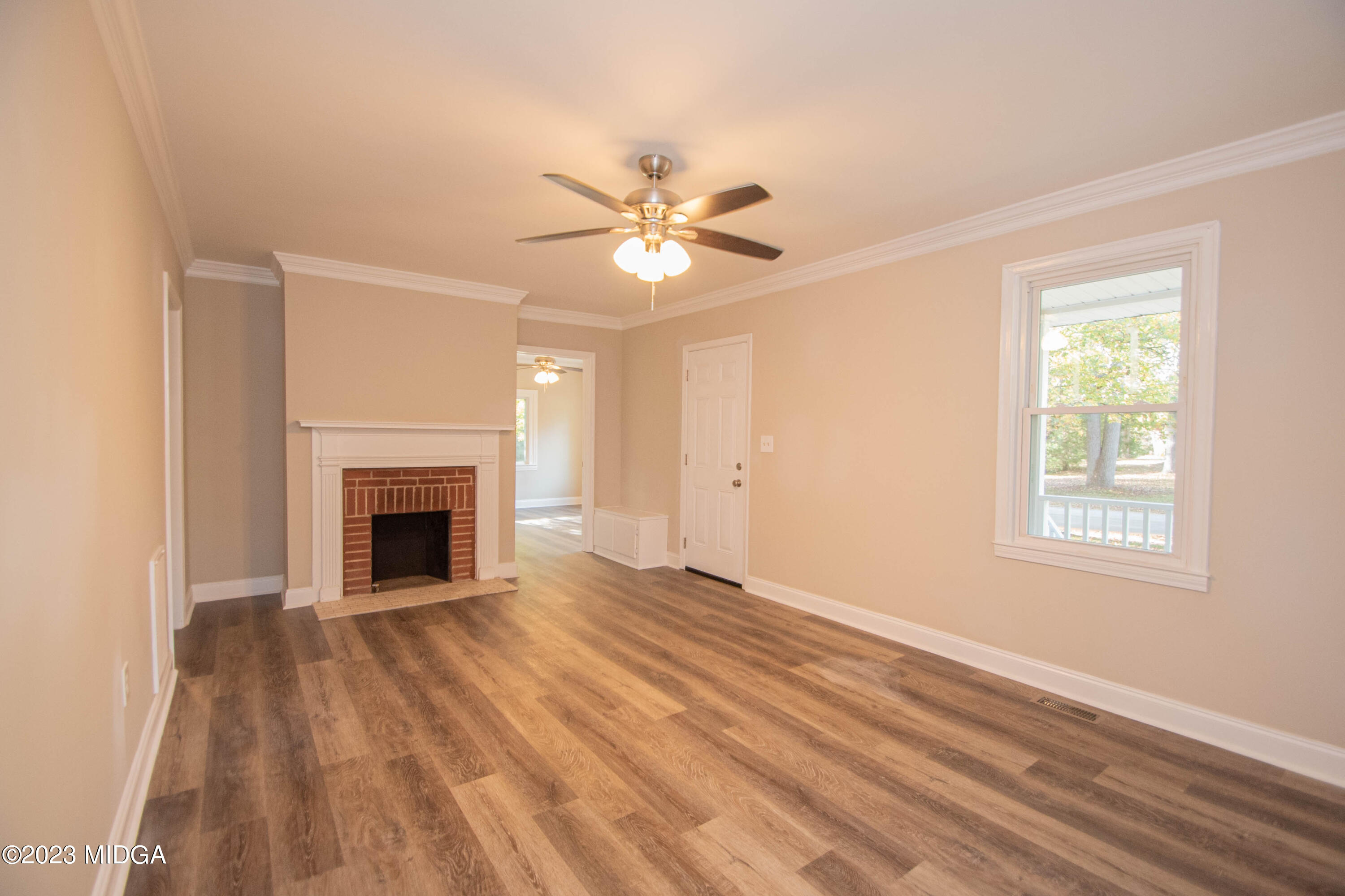 225 R Street Northwest Thomaston, GA 30286 - Photo 8 of 22 a view of empty room with fireplace and fan