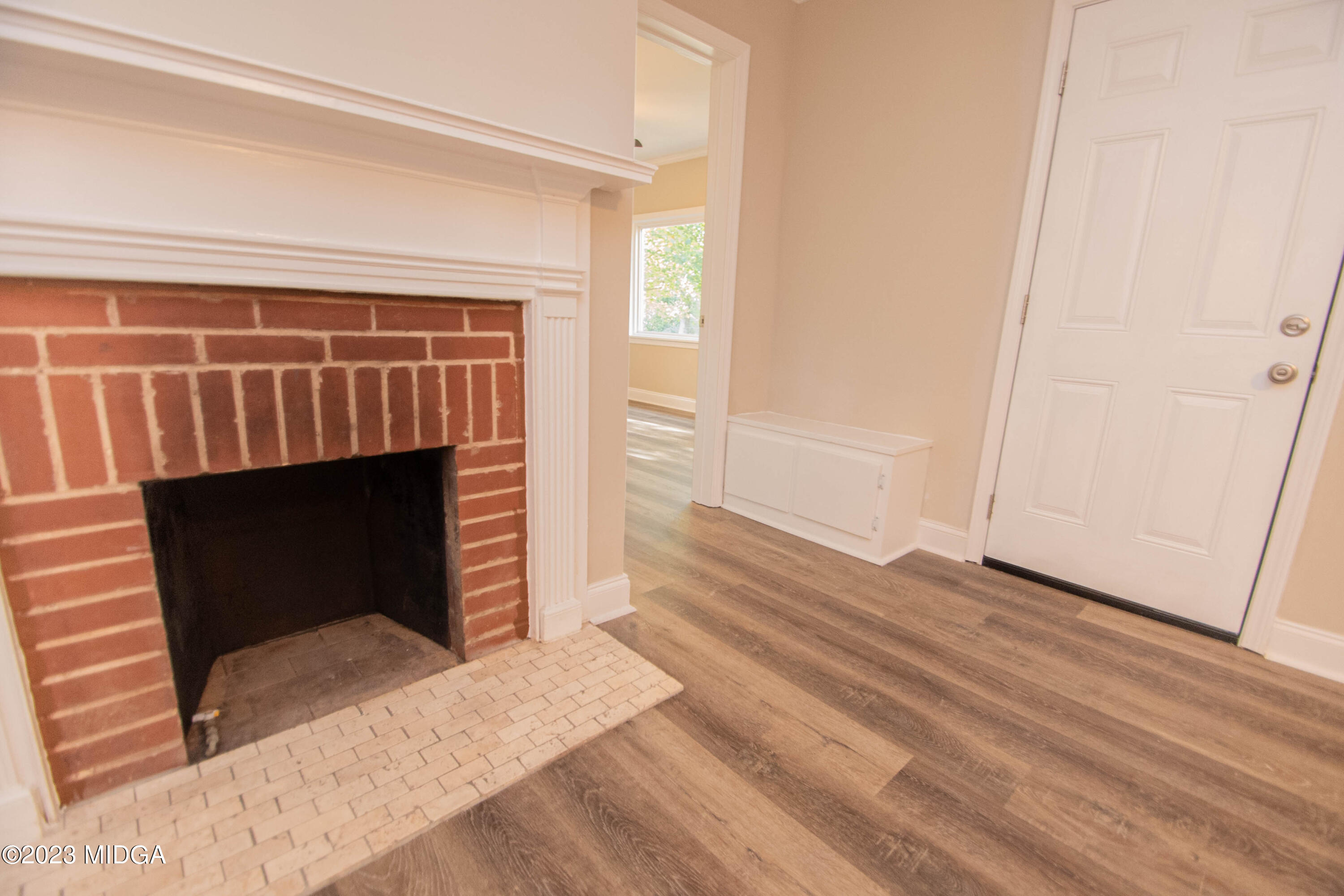 225 R Street Northwest Thomaston, GA 30286 - Photo 10 of 22 a view of a livingroom with wooden floor and a fireplace
