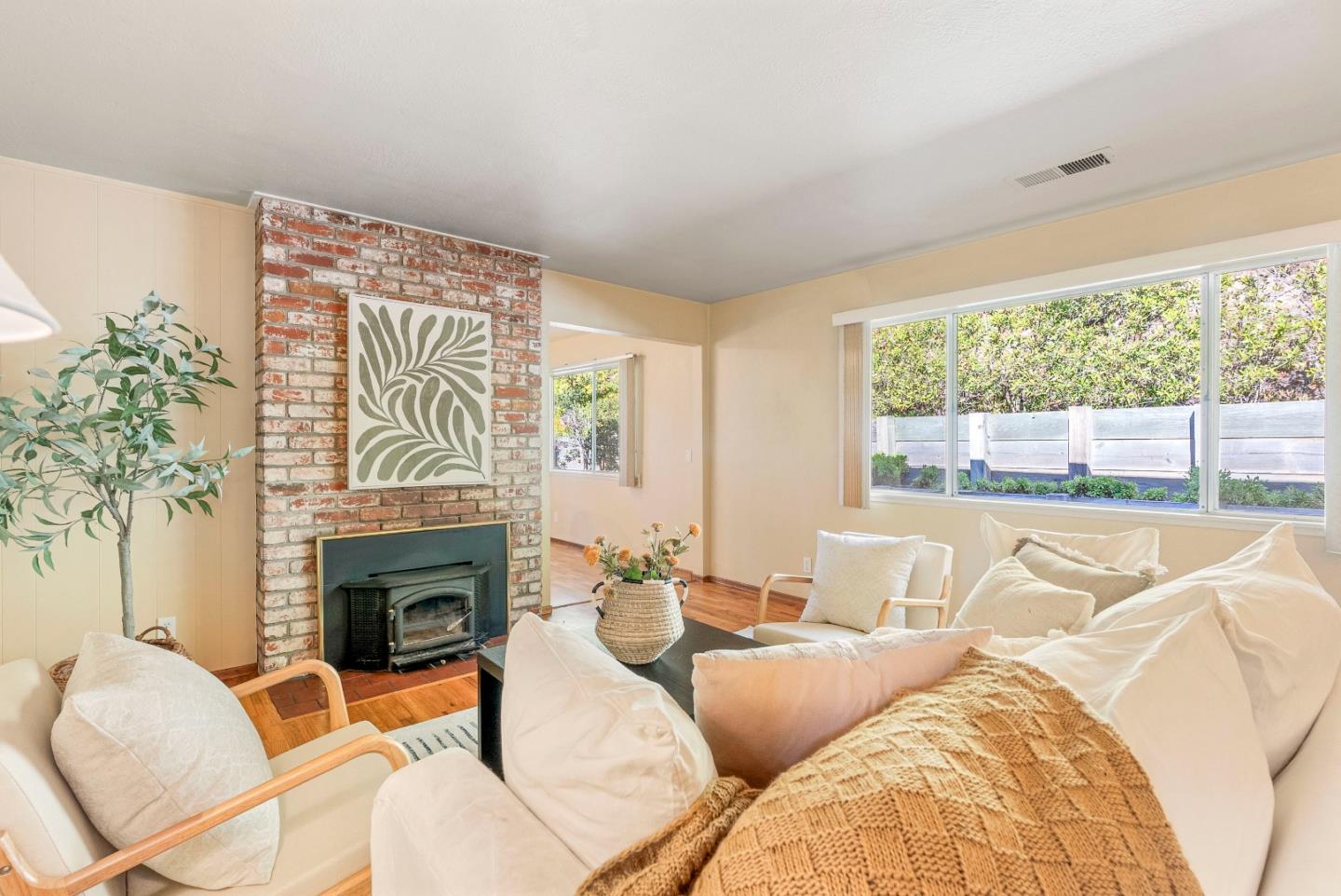1461 Vía Marettimo Monterey, CA 93940 - Photo 11 of 38 a living room with furniture a fireplace and a floor to ceiling window