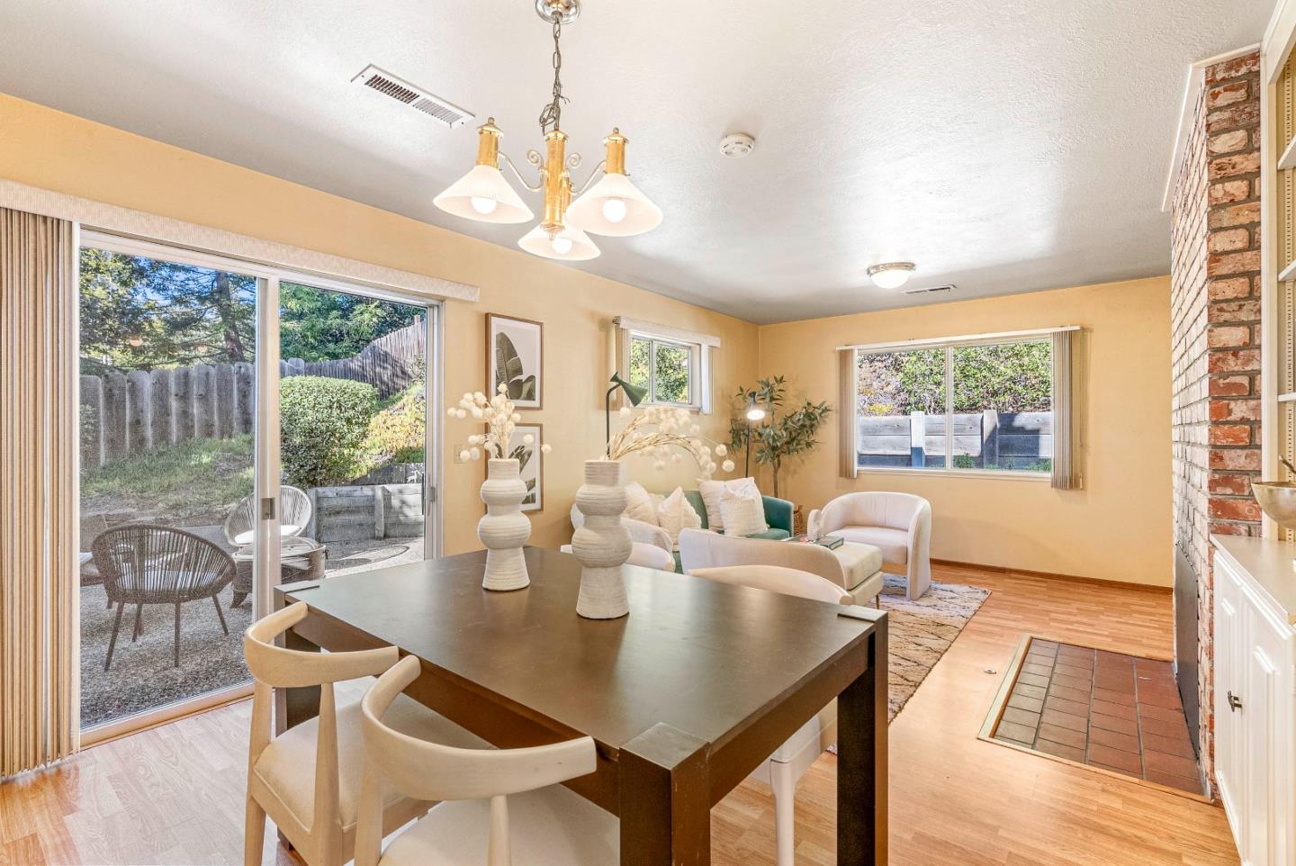 1461 Vía Marettimo Monterey, CA 93940 - Photo 13 of 38 a view of a dining room with furniture wooden floor and chandelier
