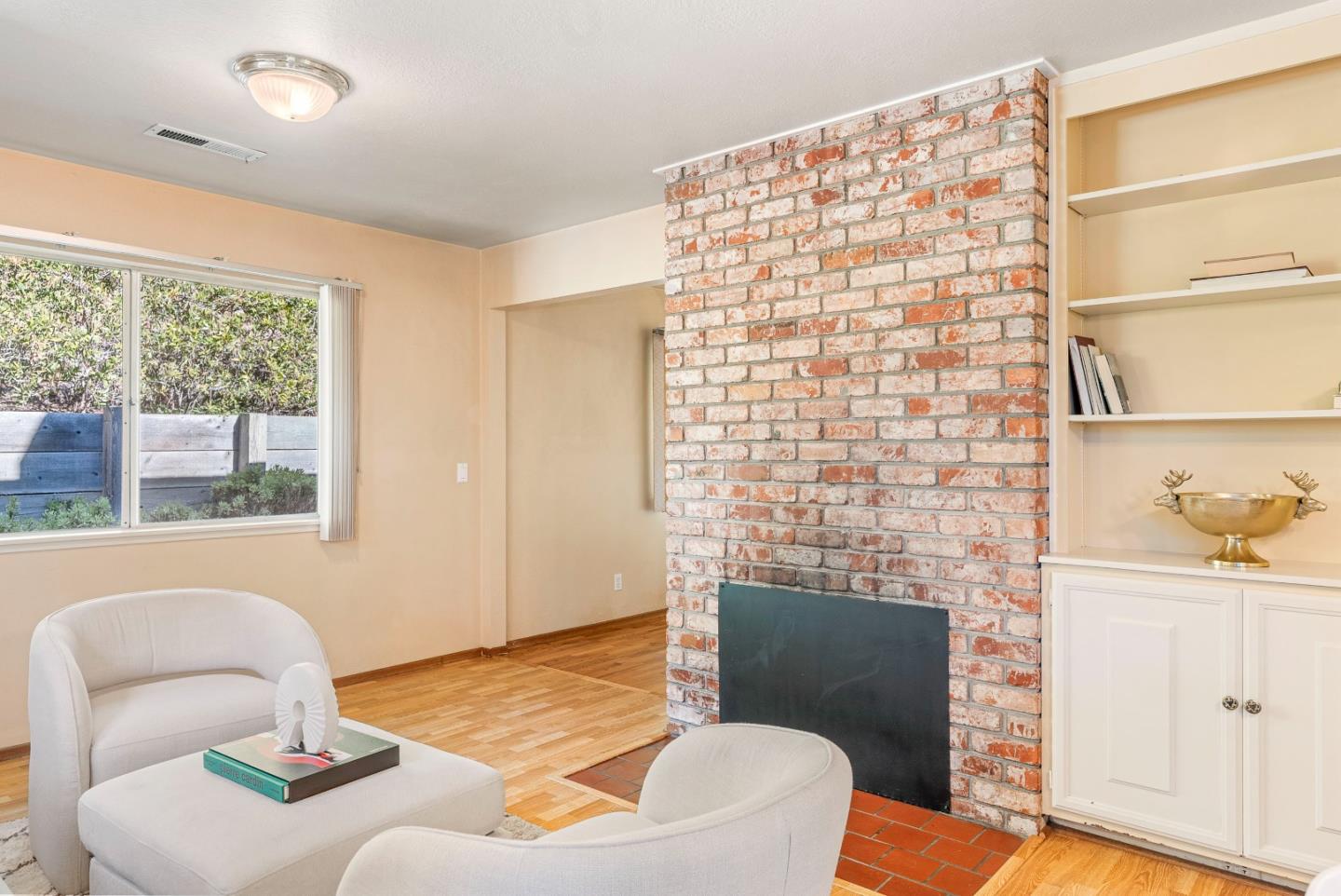 1461 Vía Marettimo Monterey, CA 93940 - Photo 17 of 38 a living room with furniture and a fireplace