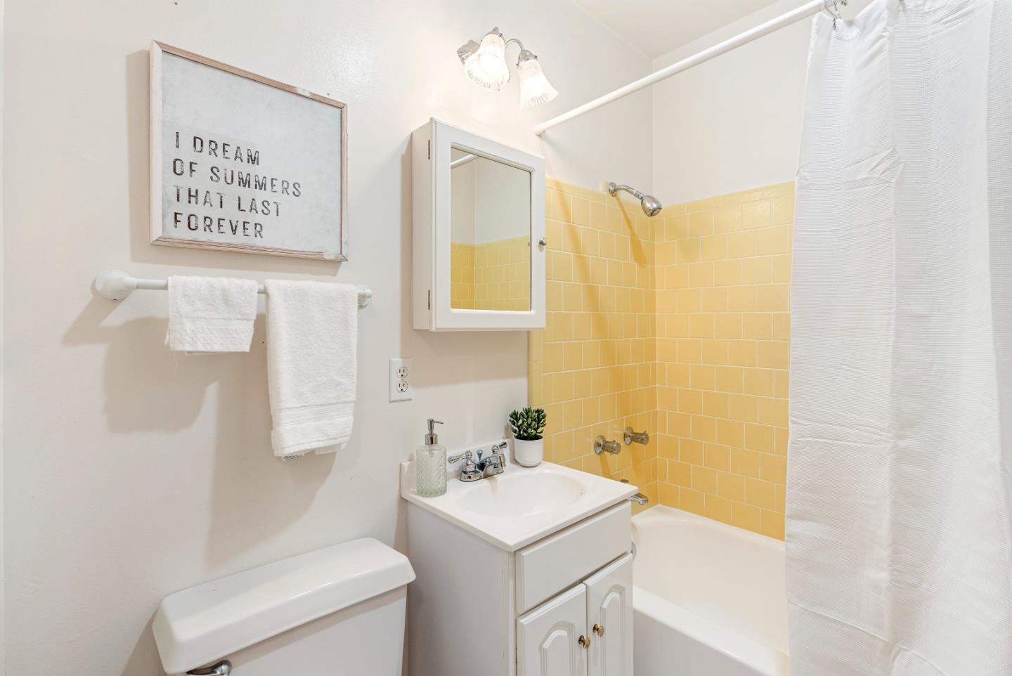 1461 Vía Marettimo Monterey, CA 93940 - Photo 27 of 38 a bathroom with a sink a toilet and a mirror