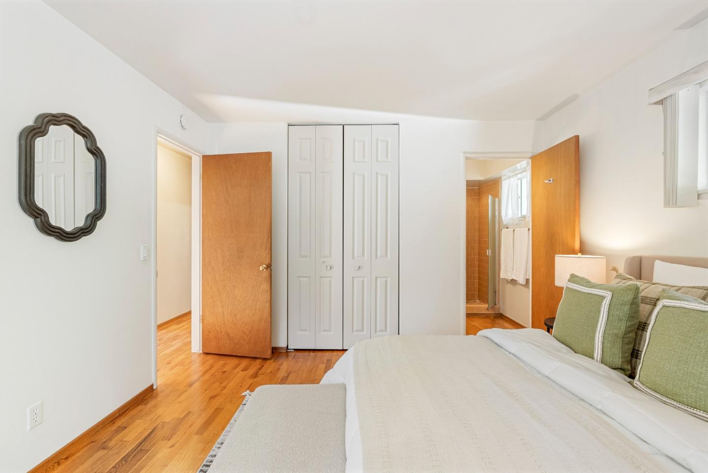 1461 Vía Marettimo Monterey, CA 93940 - Photo 33 of 38 a bedroom with a bed a mirror and a window