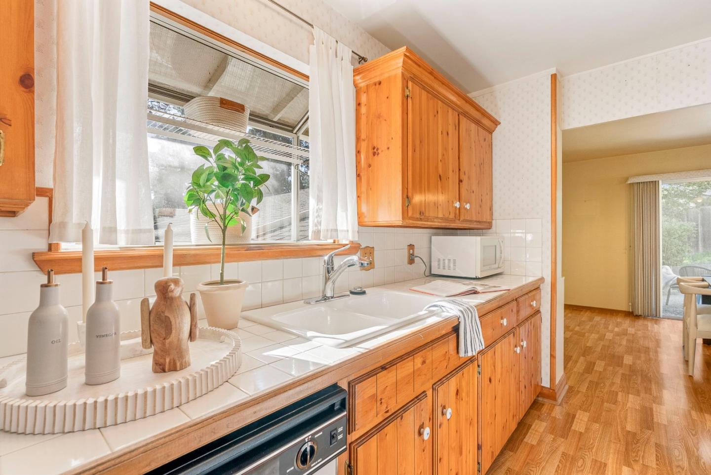 1461 Vía Marettimo Monterey, CA 93940 - Photo 6 of 38 a kitchen with a sink and a window