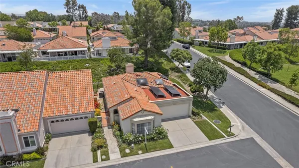 an aerial view of house with yard