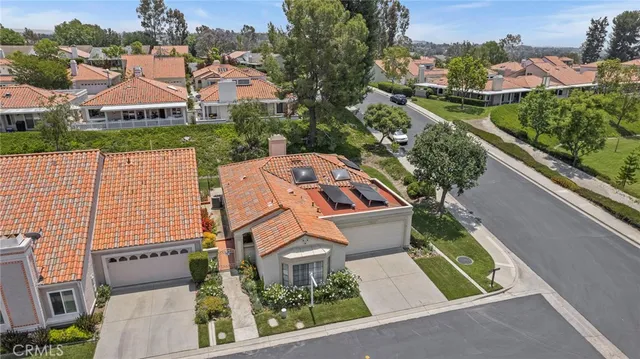 an aerial view of house with yard