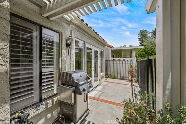 a view of a chair and table in the balcony