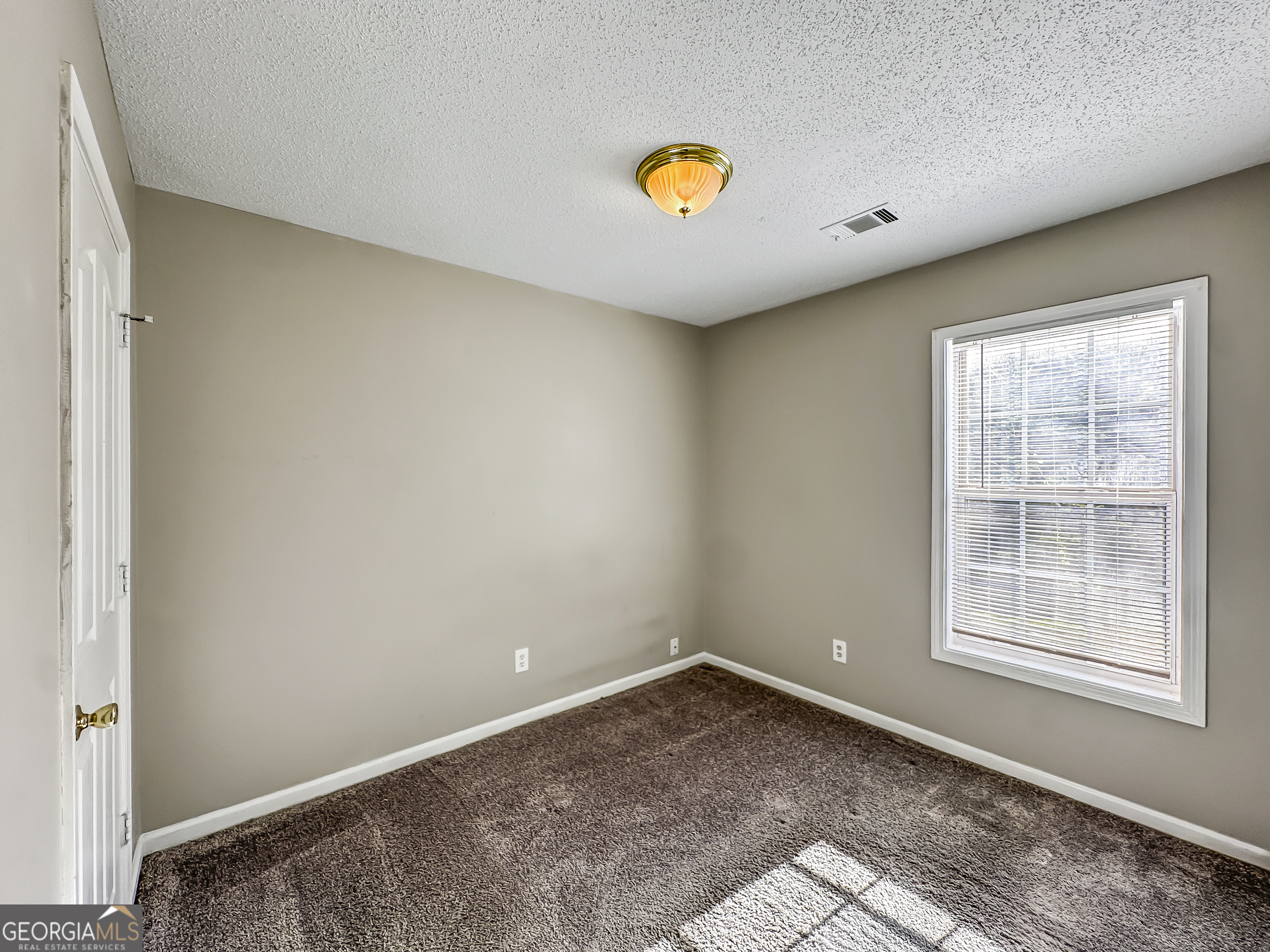 11084 Knotty Pine Place Hampton, GA 30228 - Photo 13 of 18 a view of a room with a window