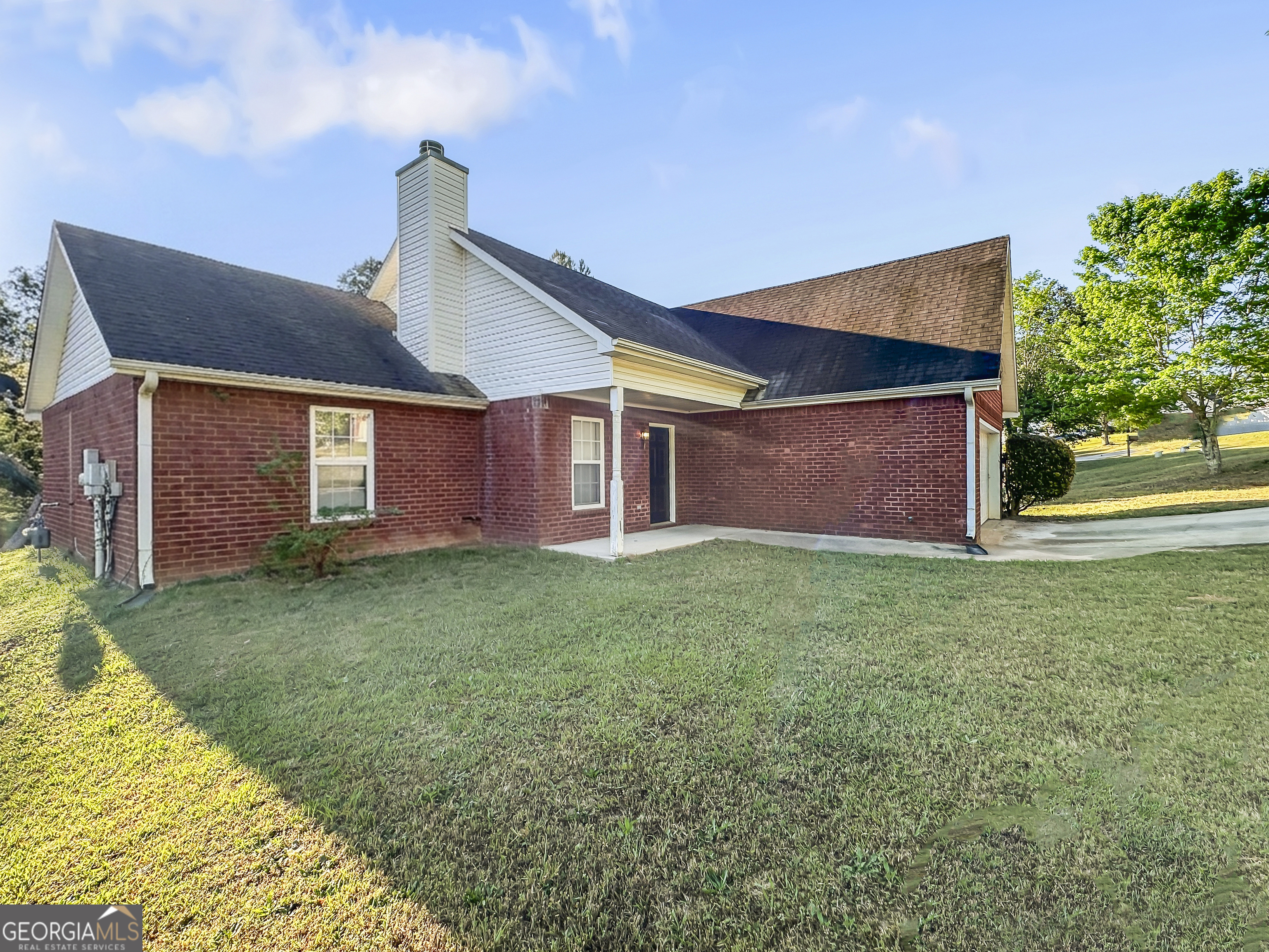 11084 Knotty Pine Place Hampton, GA 30228 - Photo 2 of 18 a backyard of a house with lots of green space