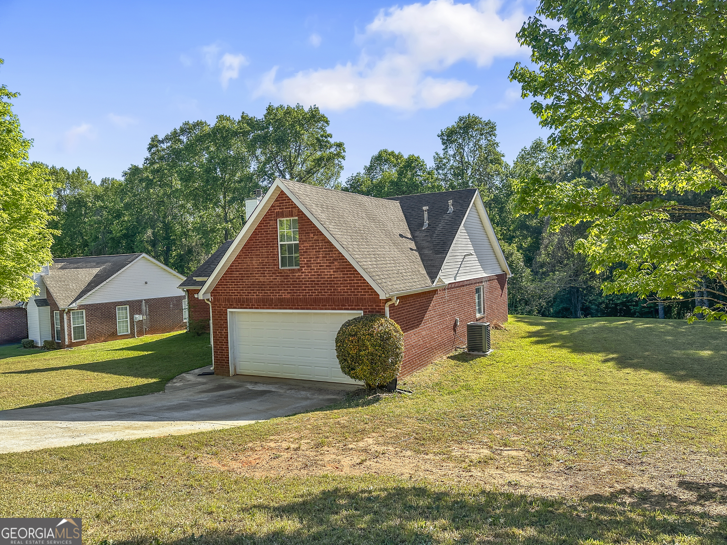 11084 Knotty Pine Place Hampton, GA 30228 - Photo 3 of 18 a house with yard in front of it
