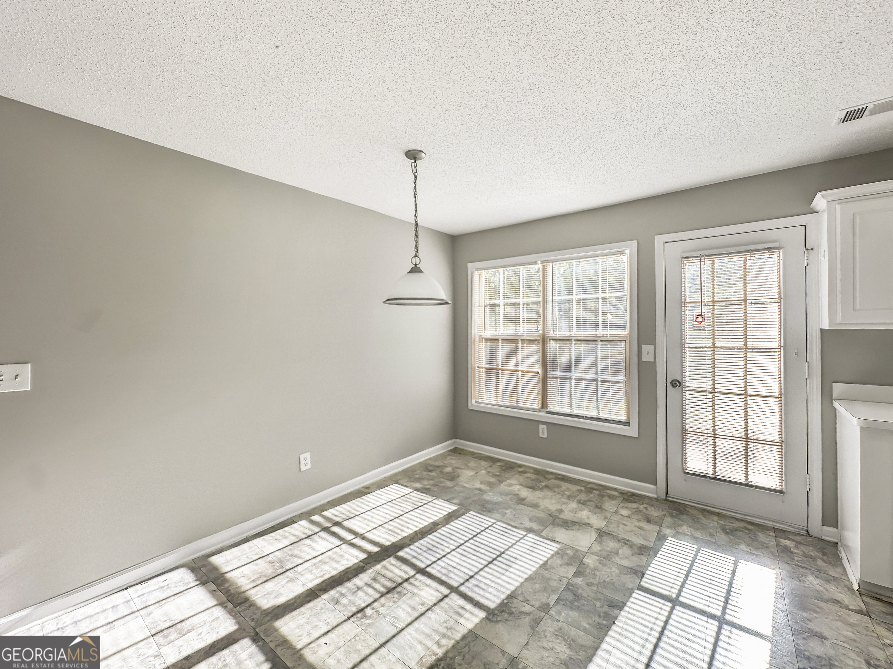 11084 Knotty Pine Place Hampton, GA 30228 - Photo 6 of 18 a view of an empty room and window