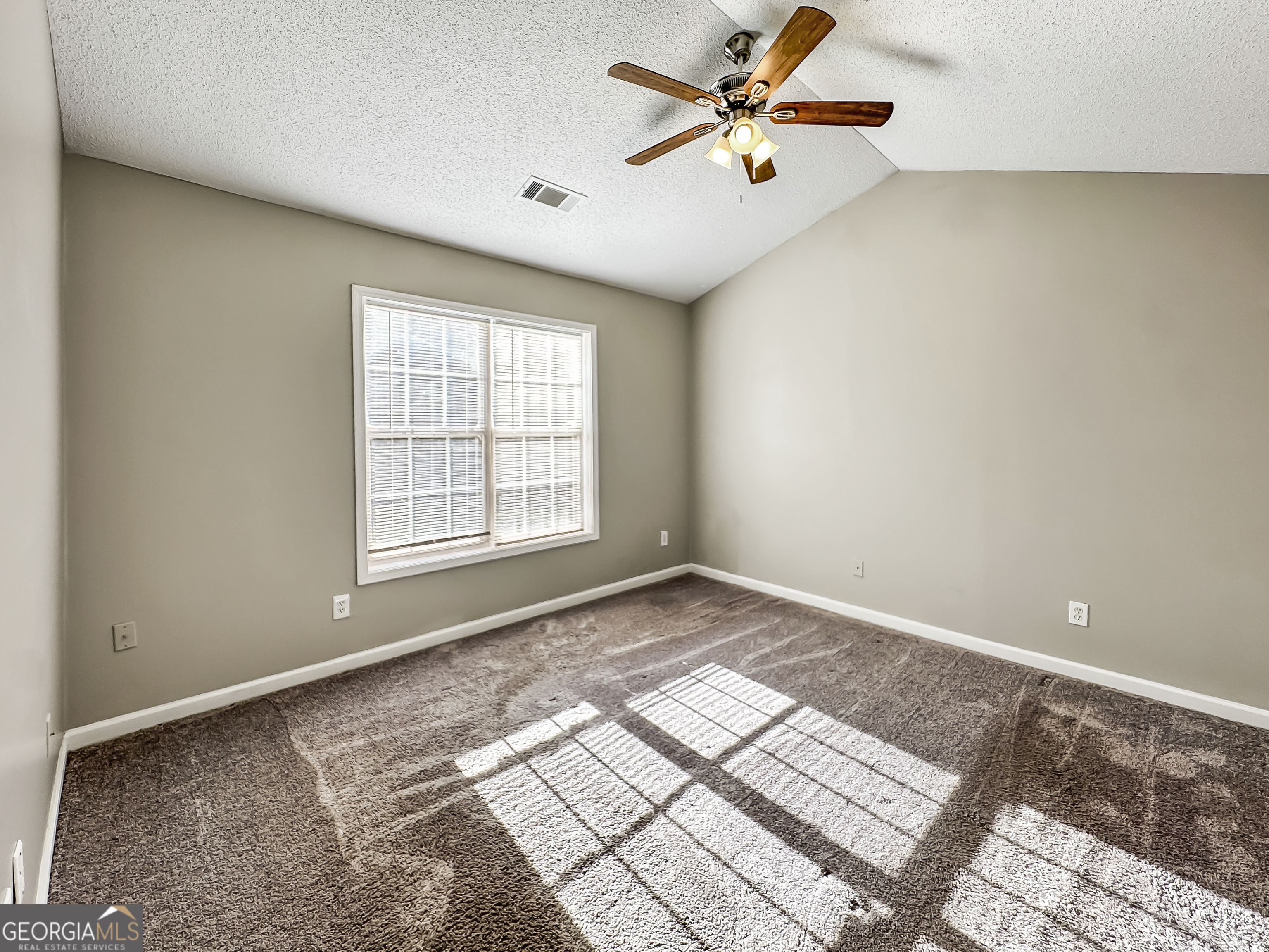 11084 Knotty Pine Place Hampton, GA 30228 - Photo 10 of 18 a view of an empty room and window