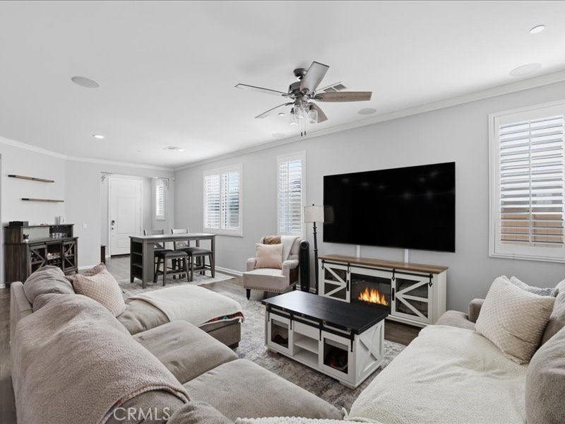 1569 Taurus Lane Beaumont, CA 92223 - Photo 14 of 33 a living room with furniture and a flat screen tv