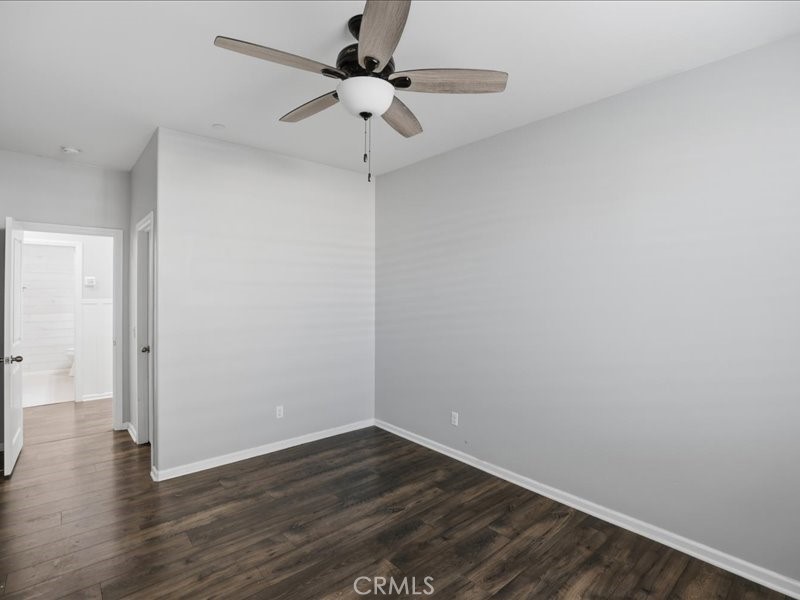 1569 Taurus Lane Beaumont, CA 92223 - Photo 17 of 33 a view of an empty room with wooden floor