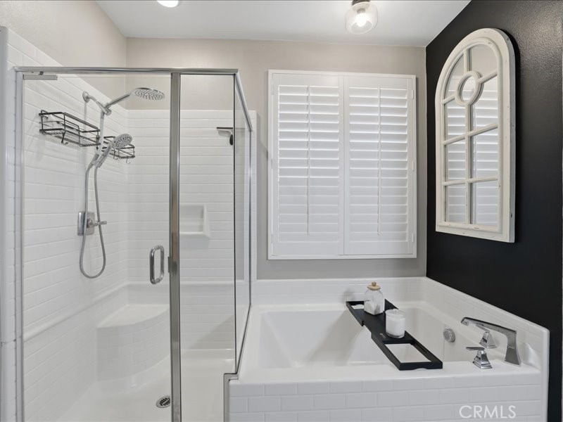1569 Taurus Lane Beaumont, CA 92223 - Photo 23 of 33 a bathroom with a bathtub and a shower