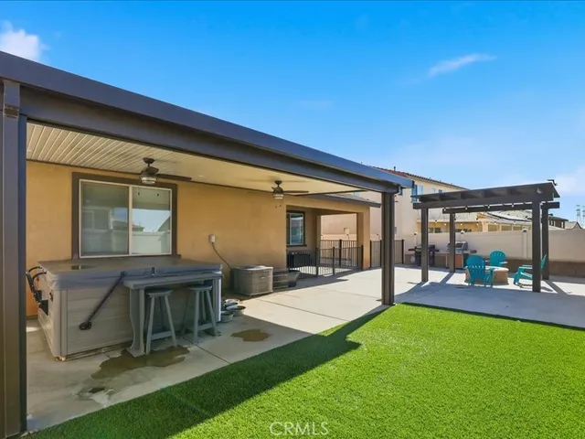 a view of an house with backyard porch and furniture