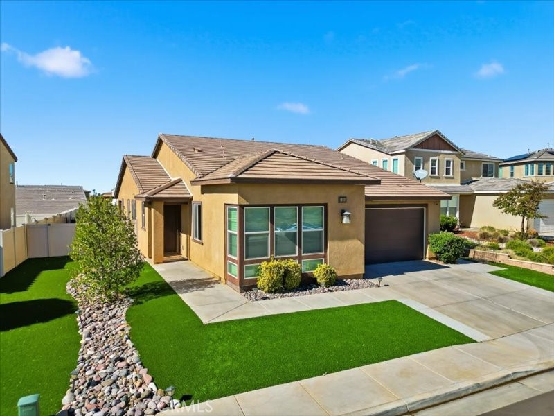 1569 Taurus Lane Beaumont, CA 92223 - Photo 3 of 33 a view of a house with a garden
