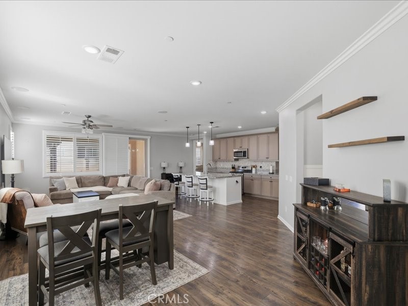 1569 Taurus Lane Beaumont, CA 92223 - Photo 5 of 33 a view of a dining room with furniture and wooden floor