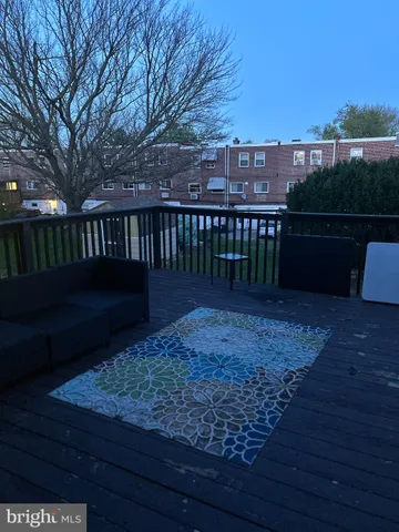 a view of a deck with a yard