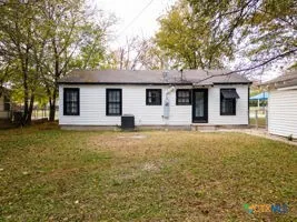 a house with trees in front of it