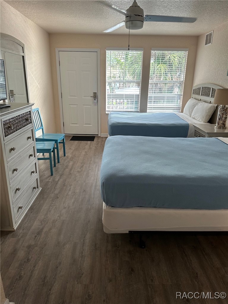 5291 South Cherokee Way Homosassa, FL 34448 - Photo 14 of 27 a spacious bedroom with a bed and a window