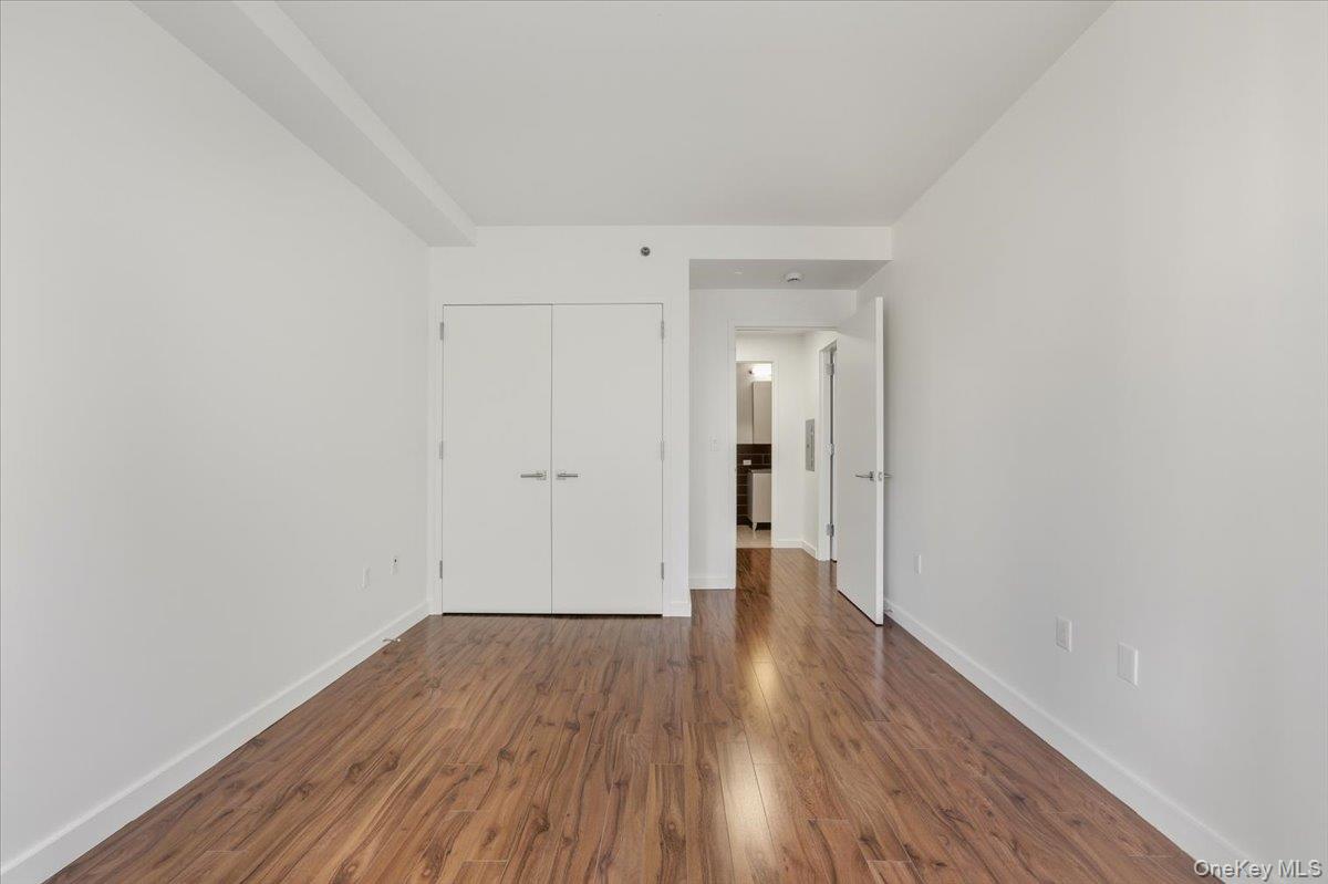 70 Fleet Street, Unit 19F Brooklyn, NY 11201 - Photo 12 of 32 a view of an empty room with wooden floor