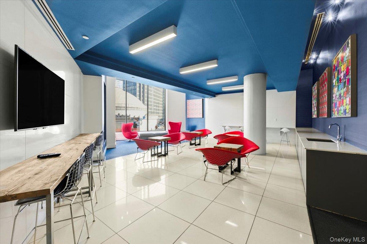 70 Fleet Street, Unit 19F Brooklyn, NY 11201 - Photo 18 of 32 a living room with furniture and a flat screen tv