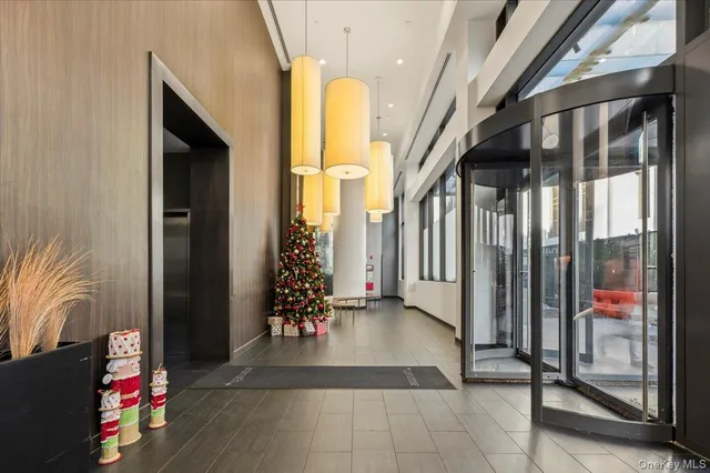a view of an entryway with wooden floor and door