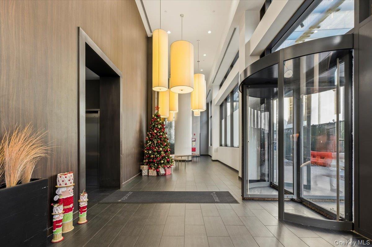 70 Fleet Street, Unit 19F Brooklyn, NY 11201 - Photo 2 of 32 a view of an entryway with wooden floor and door