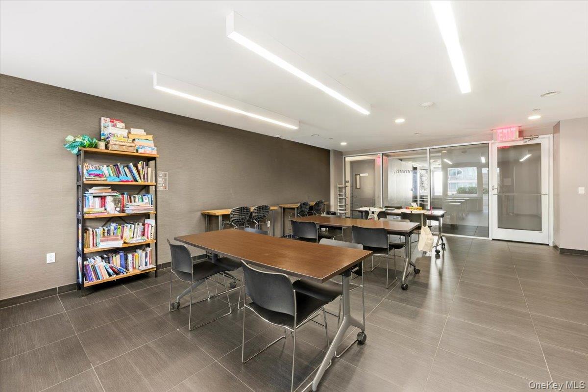 70 Fleet Street, Unit 19F Brooklyn, NY 11201 - Photo 29 of 32 a room with furniture and gym equipment