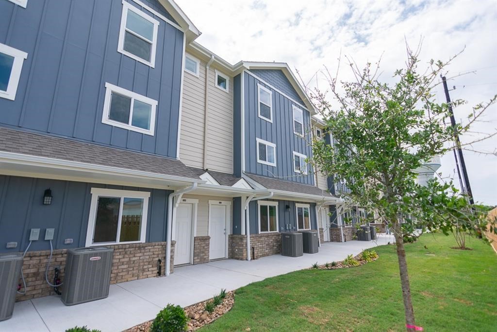 21155 Gosling Road, Unit 38C Spring, TX 77388 - Photo 1 of 21 a view of a house with a yard and sitting area