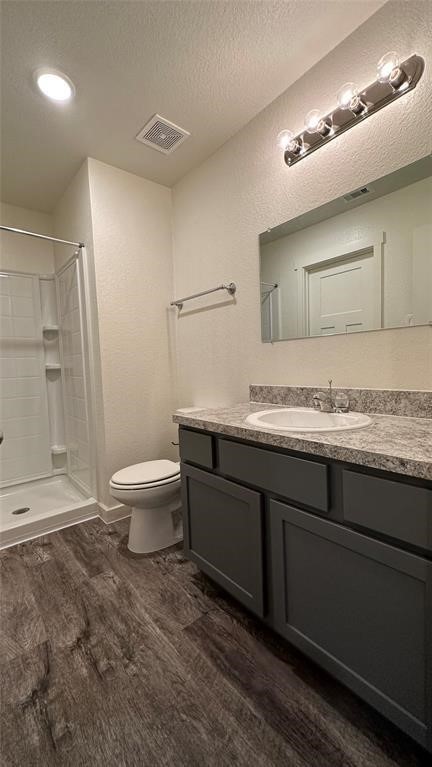 21155 Gosling Road, Unit 38C Spring, TX 77388 - Photo 13 of 21 a bathroom with a granite countertop sink a toilet and a mirror