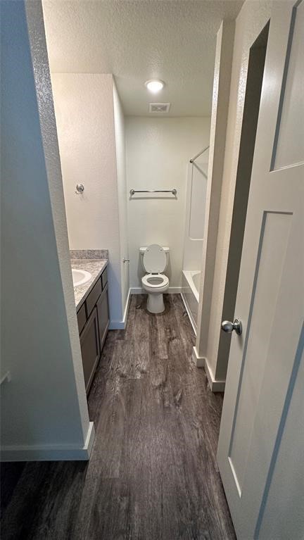 21155 Gosling Road, Unit 38C Spring, TX 77388 - Photo 16 of 21 a view of a hallway with wooden floor and staircase
