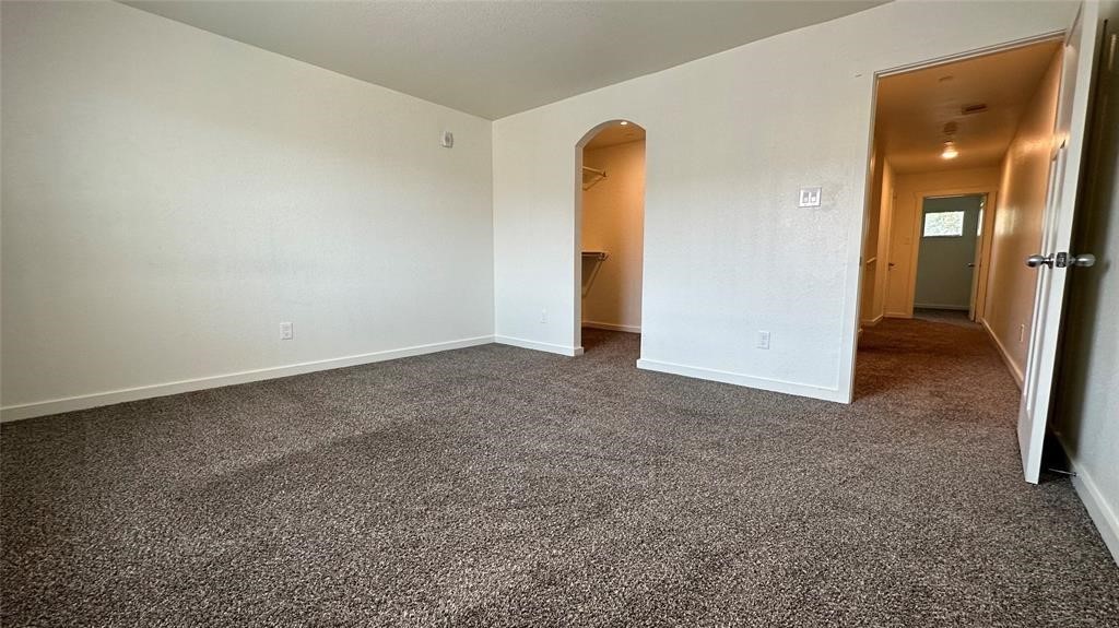 21155 Gosling Road, Unit 38C Spring, TX 77388 - Photo 18 of 21 an empty room with a door