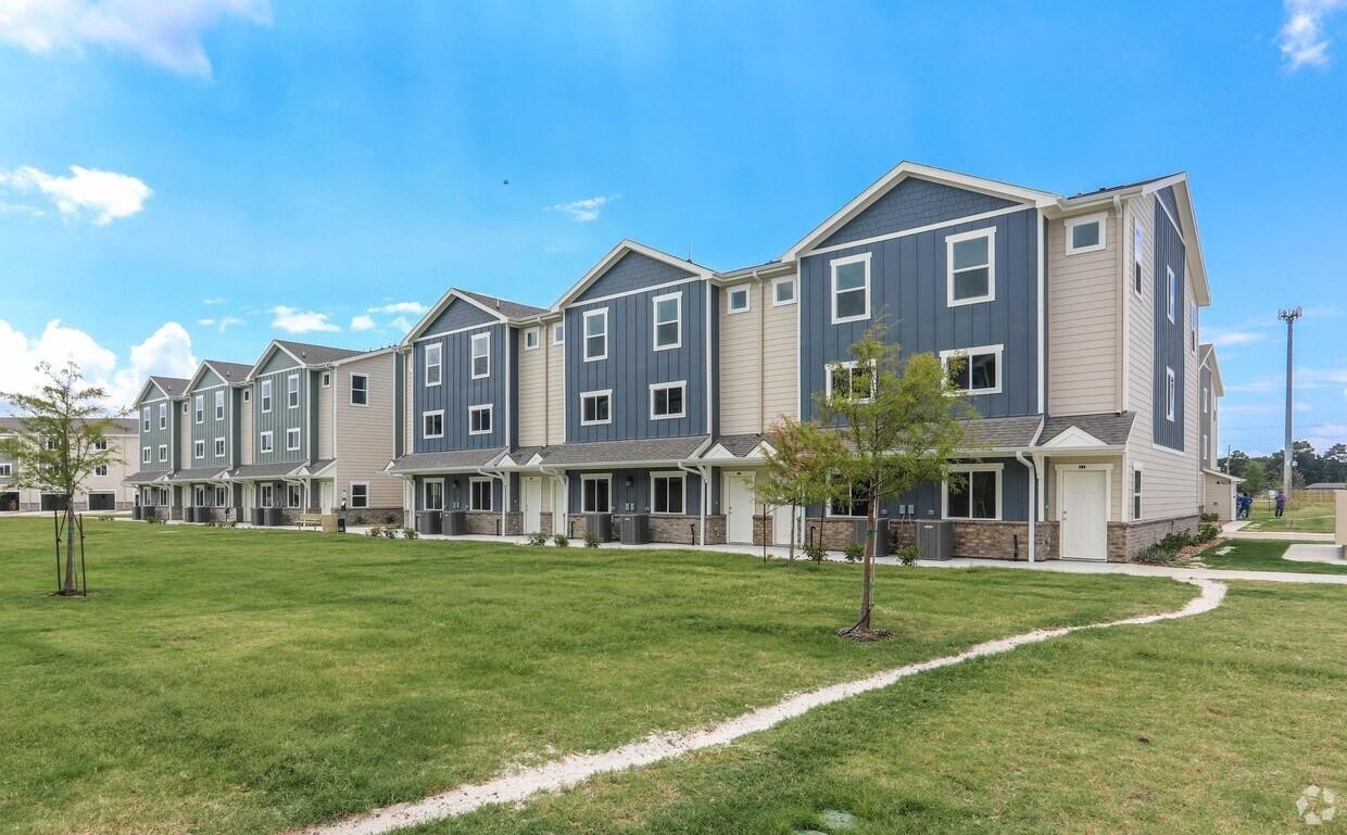 21155 Gosling Road, Unit 38C Spring, TX 77388 - Photo 2 of 21 a front view of a building with a garden